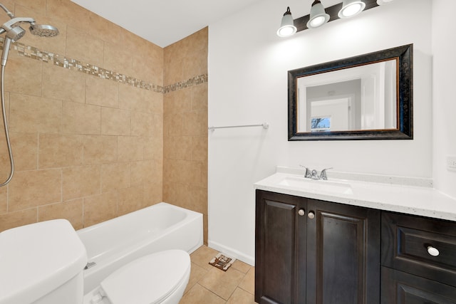 full bathroom featuring tile patterned floors, vanity, toilet, and tiled shower / bath combo