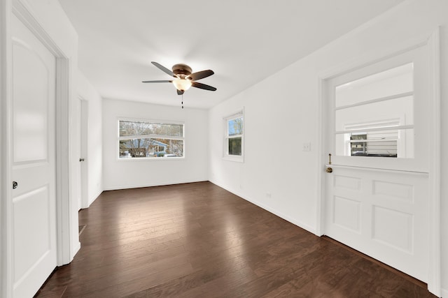 interior space featuring ceiling fan and dark hardwood / wood-style flooring