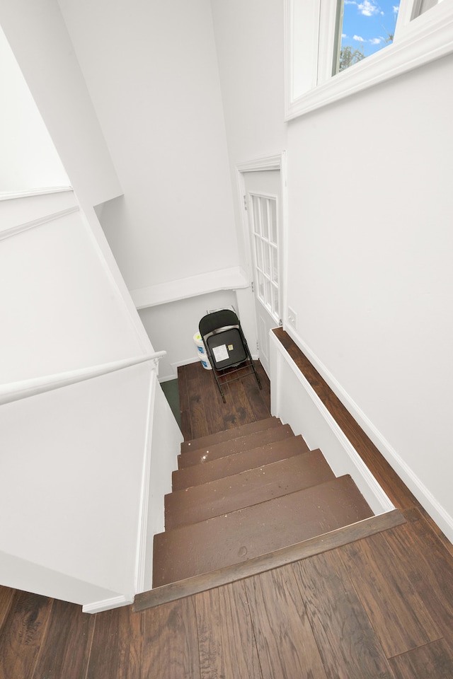 staircase featuring hardwood / wood-style flooring