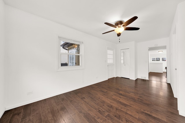 unfurnished room with ceiling fan and dark hardwood / wood-style flooring