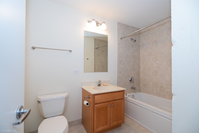 full bathroom with tile patterned flooring, vanity, tiled shower / bath combo, and toilet