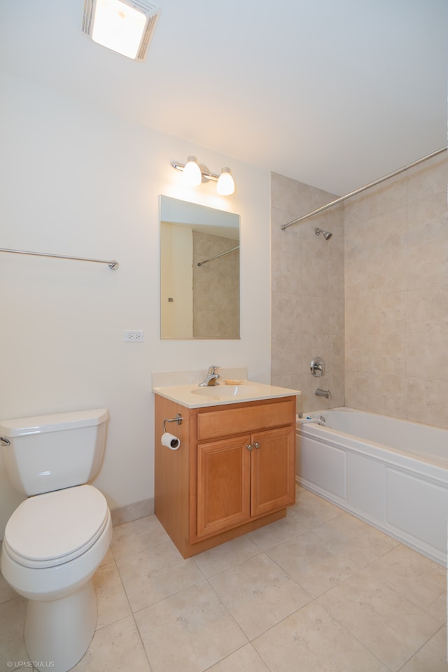 full bathroom featuring vanity, tile patterned floors, tiled shower / bath combo, and toilet