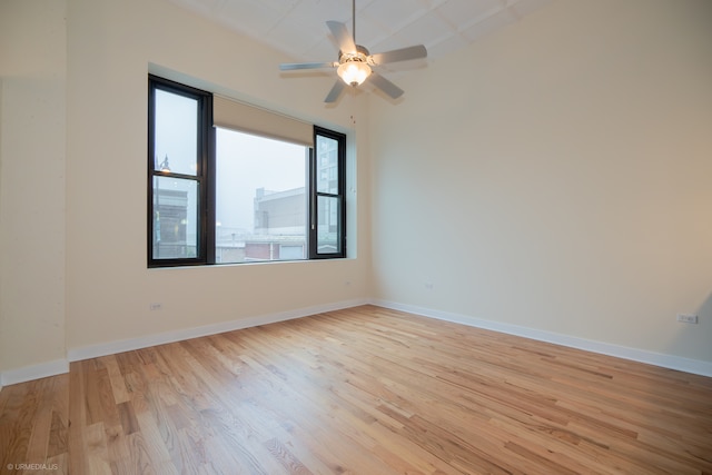 unfurnished room featuring light wood-type flooring and ceiling fan