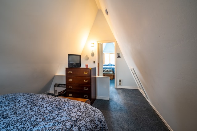 carpeted bedroom with vaulted ceiling