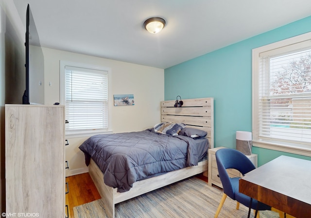 bedroom featuring wood-type flooring