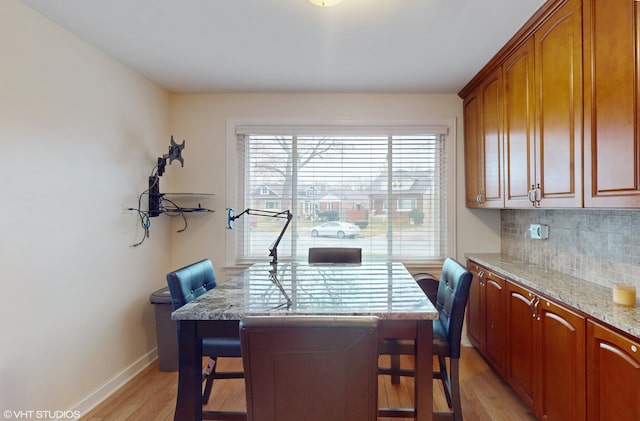 dining space featuring light wood-type flooring