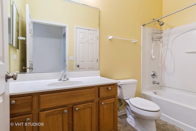 full bathroom featuring bathtub / shower combination, vanity, and toilet