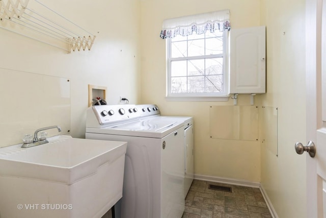 laundry area with sink and washing machine and dryer