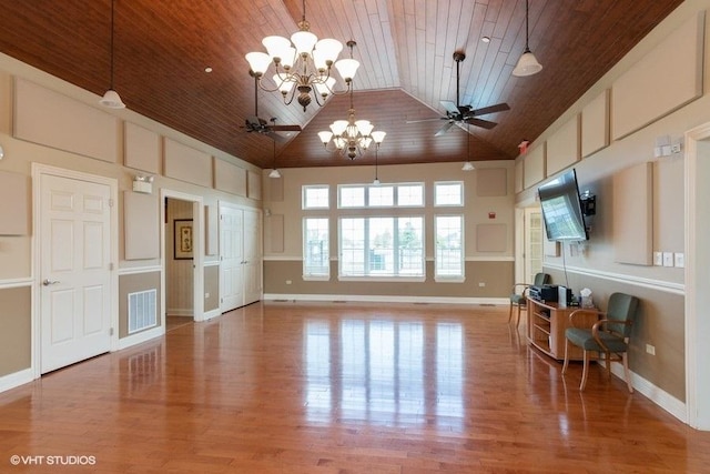 unfurnished living room featuring hardwood / wood-style flooring, ceiling fan, high vaulted ceiling, and wood ceiling