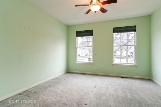 carpeted empty room with ceiling fan