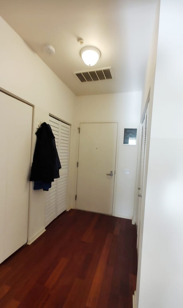 doorway to outside featuring dark hardwood / wood-style flooring