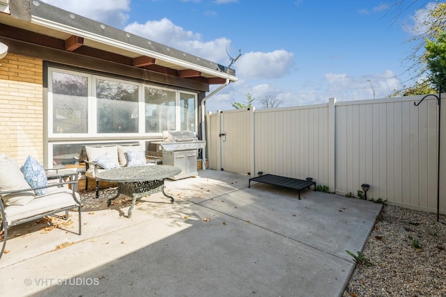 view of patio with a grill