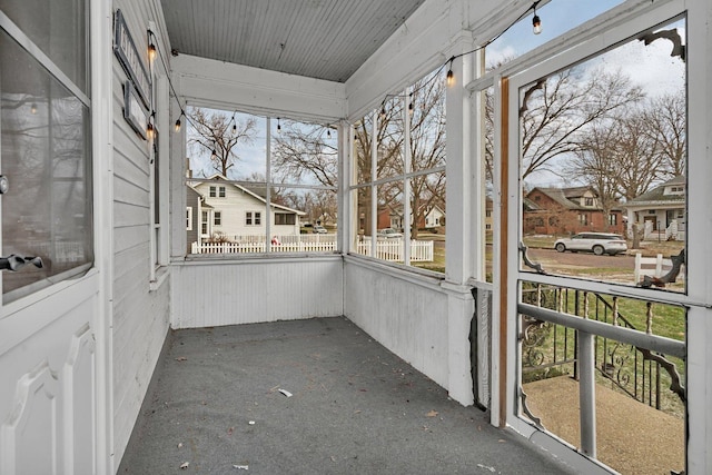 unfurnished sunroom featuring a wealth of natural light