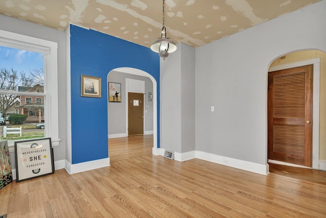 unfurnished room featuring light hardwood / wood-style floors