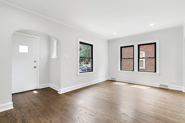 foyer featuring dark hardwood / wood-style flooring and ornamental molding