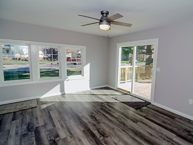 unfurnished room featuring hardwood / wood-style floors, plenty of natural light, and ceiling fan