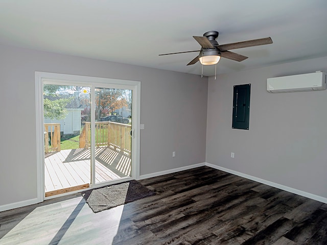 spare room with dark hardwood / wood-style floors, ceiling fan, an AC wall unit, and electric panel