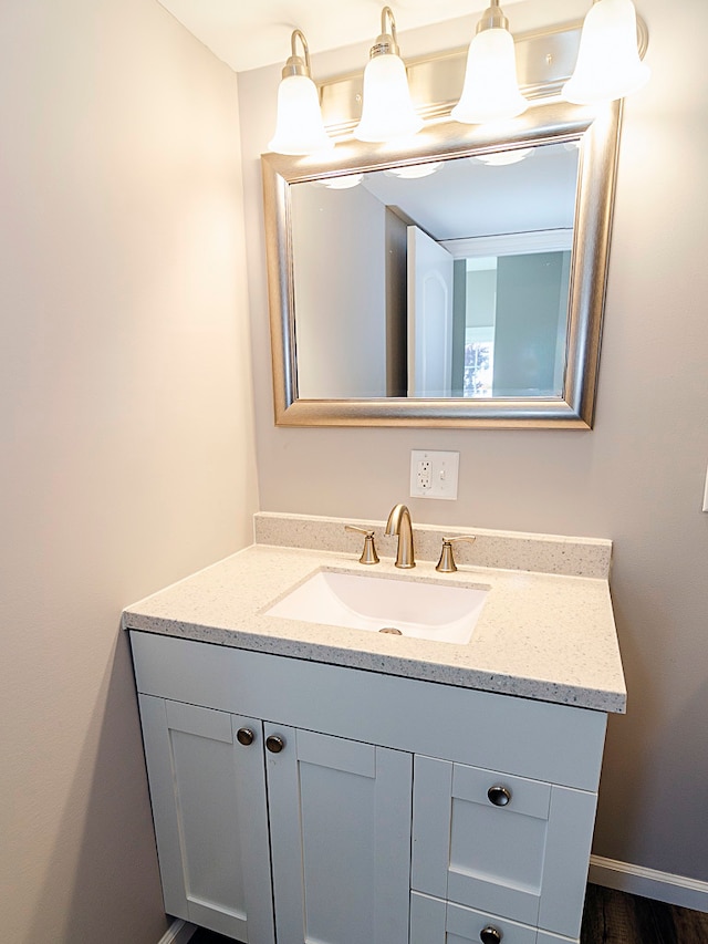 bathroom with vanity and hardwood / wood-style flooring