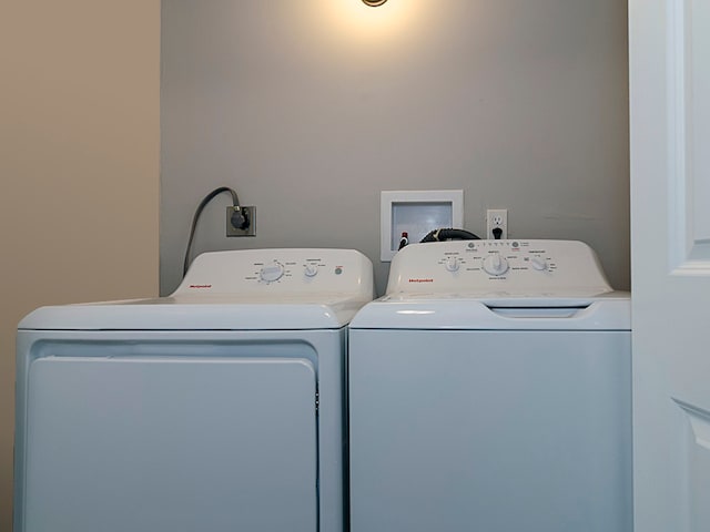 clothes washing area featuring washing machine and dryer