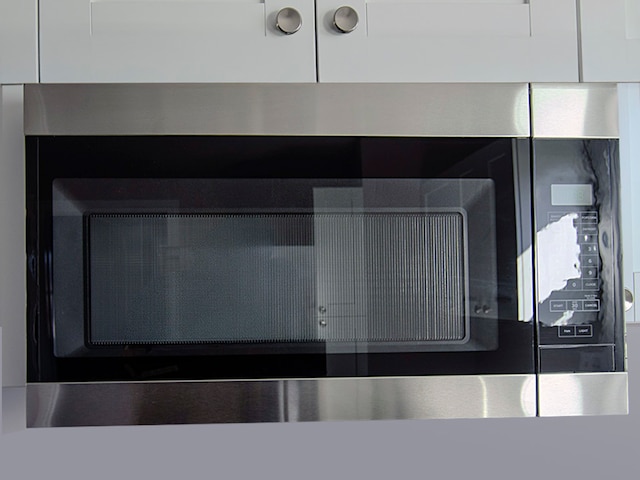 interior details featuring white cabinetry