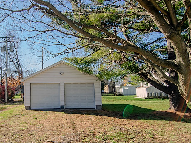 garage with a lawn