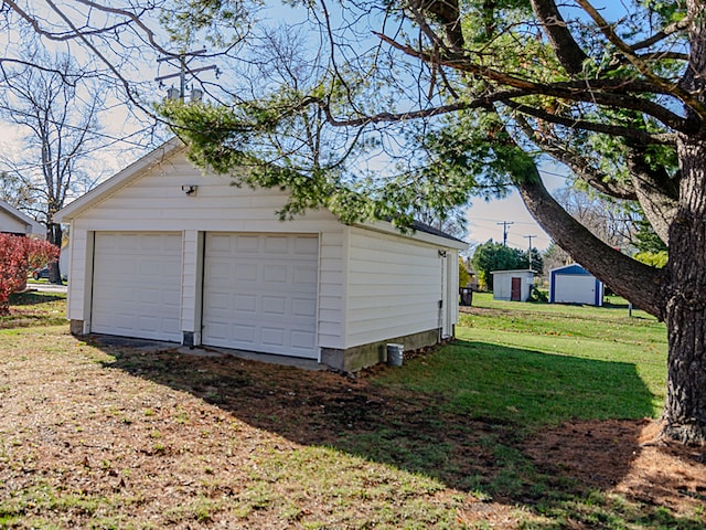 garage featuring a yard