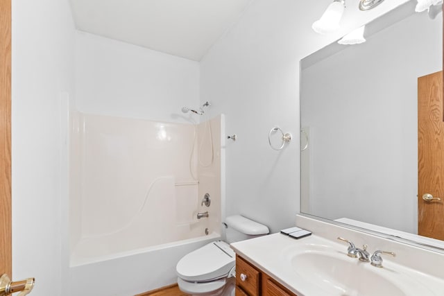 bathroom featuring shower / tub combination, vanity, and toilet