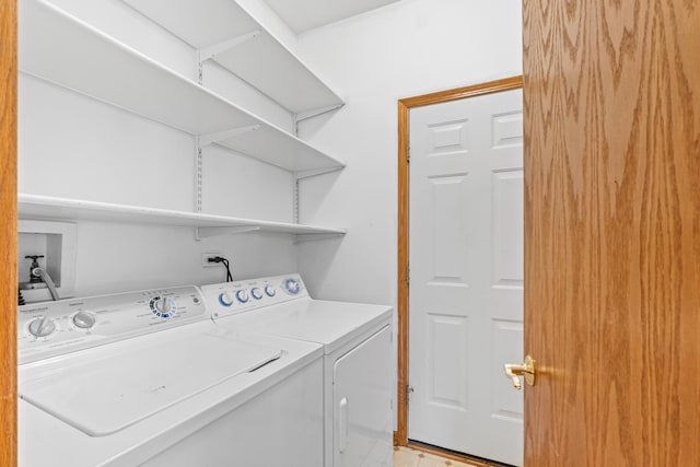 clothes washing area with laundry area and washer and dryer