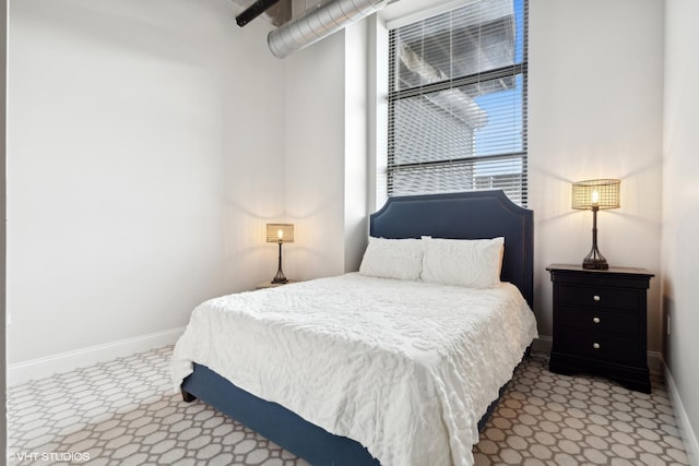 carpeted bedroom with baseboards