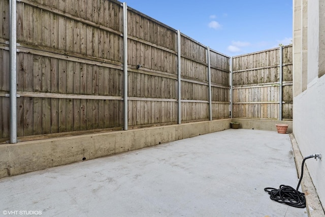 view of patio / terrace featuring fence