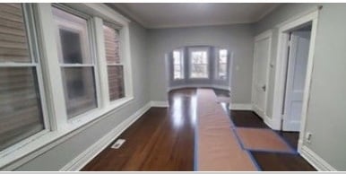 hallway featuring dark hardwood / wood-style floors