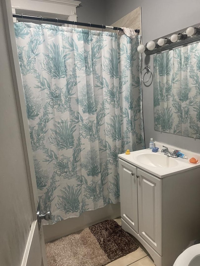 bathroom with tile patterned flooring, vanity, and a shower with shower curtain