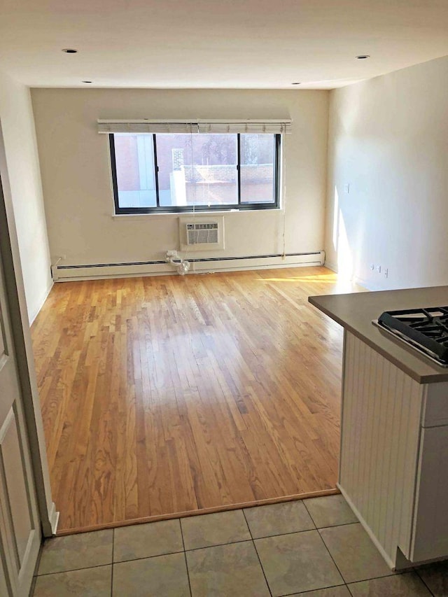 interior space featuring light hardwood / wood-style floors and a wall mounted air conditioner