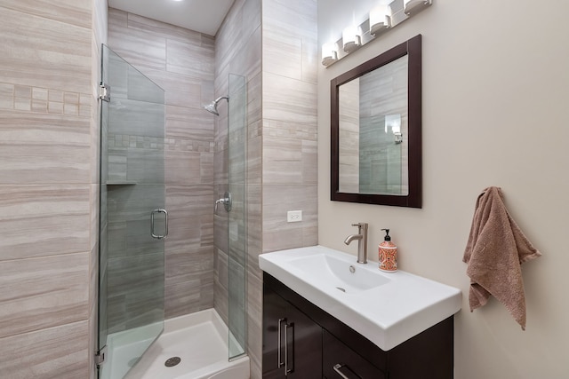 bathroom with vanity and an enclosed shower