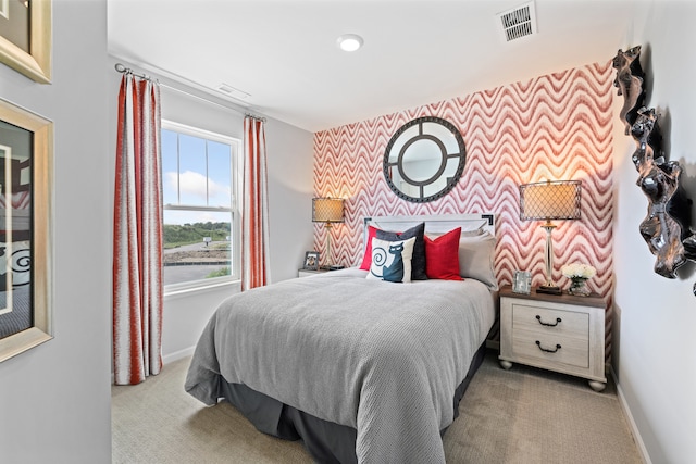 bedroom with light colored carpet