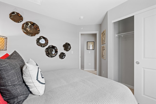 carpeted bedroom featuring a closet