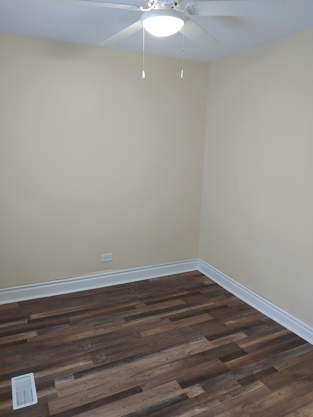 unfurnished room with dark hardwood / wood-style floors and ceiling fan