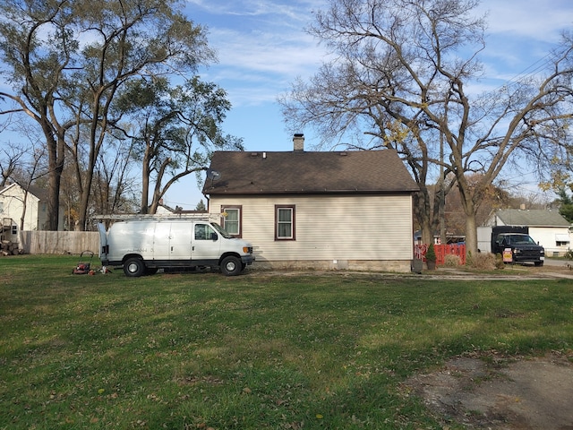 view of property exterior with a yard