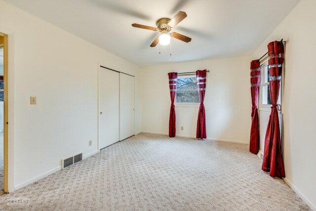 kitchen featuring ceiling fan, stainless steel appliances, and kitchen peninsula