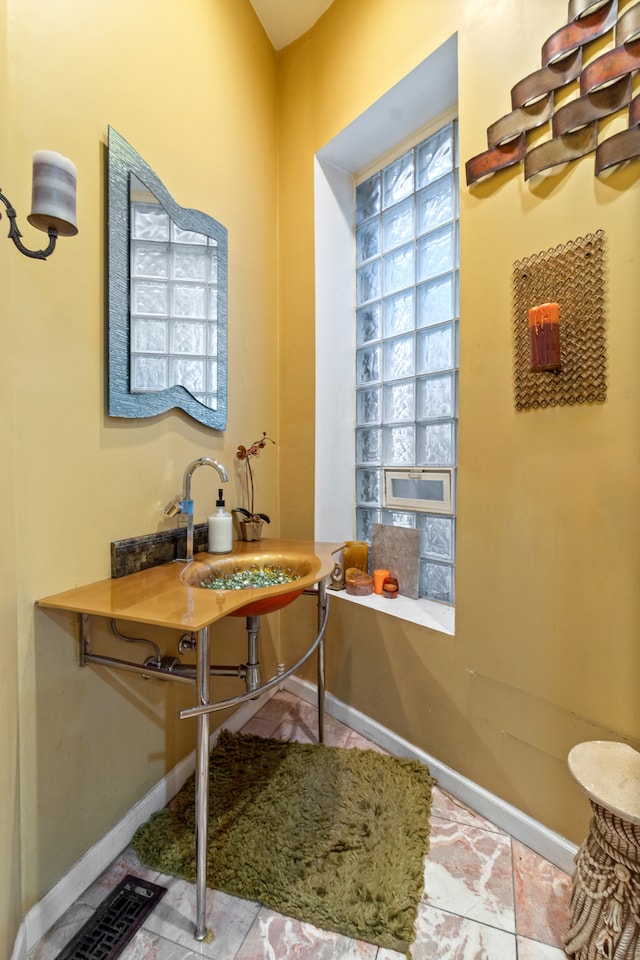 bathroom featuring tile patterned floors and sink