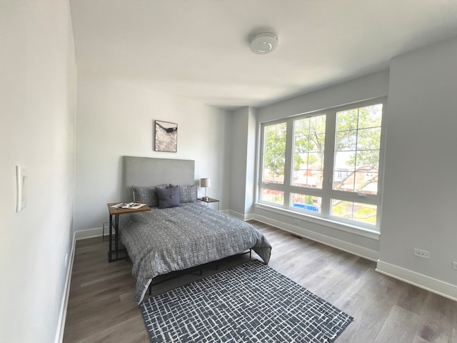 bedroom with wood-type flooring