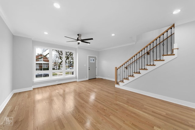 unfurnished living room with ceiling fan, light hardwood / wood-style floors, and ornamental molding