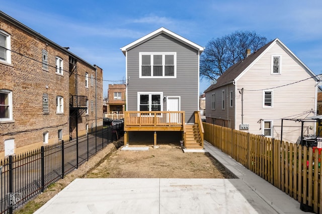 rear view of house with a wooden deck