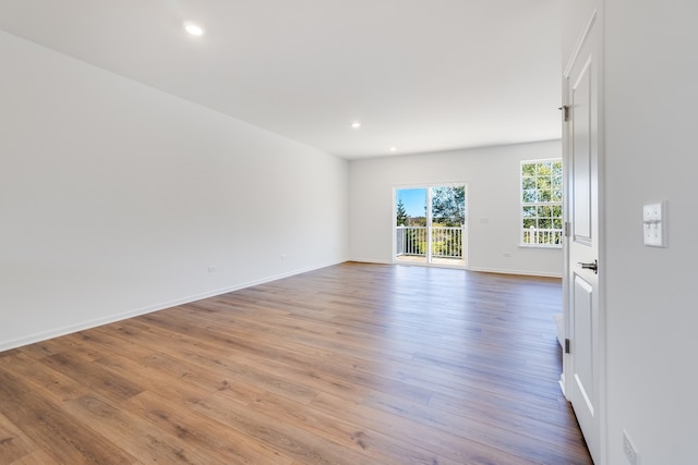 empty room with light hardwood / wood-style floors