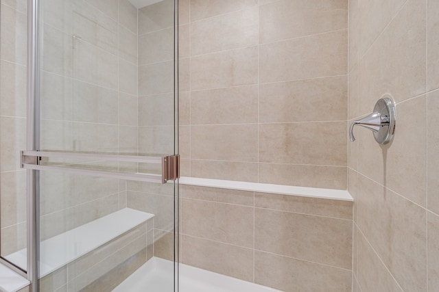 bathroom featuring an enclosed shower