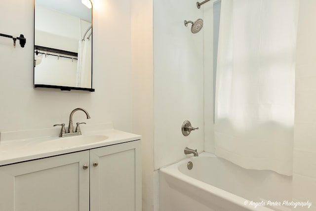 bathroom with vanity and shower / bath combo with shower curtain