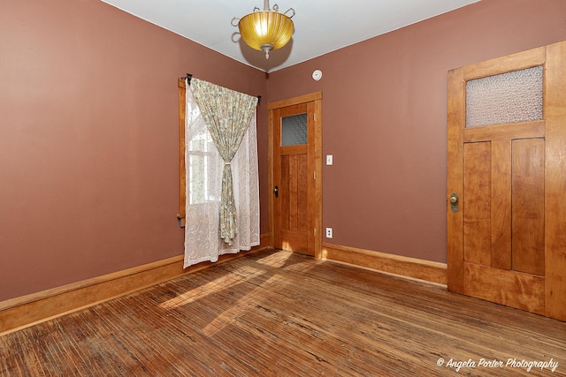 empty room with wood-type flooring