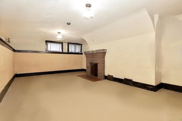 basement with a brick fireplace