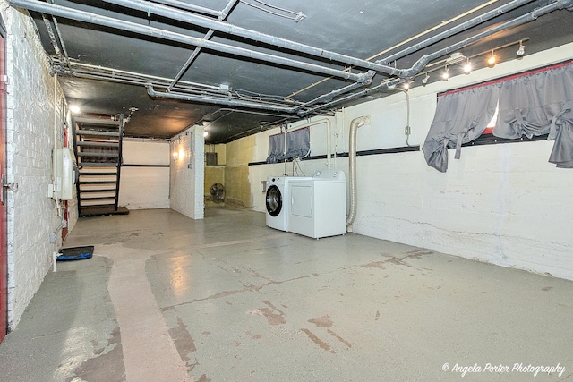 basement with washer and clothes dryer