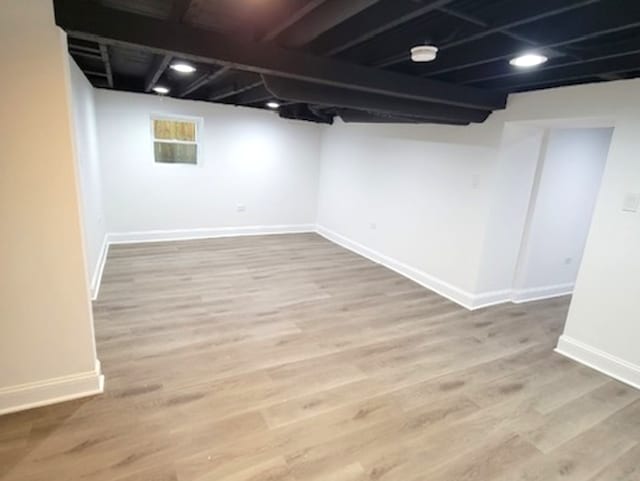 basement featuring hardwood / wood-style flooring